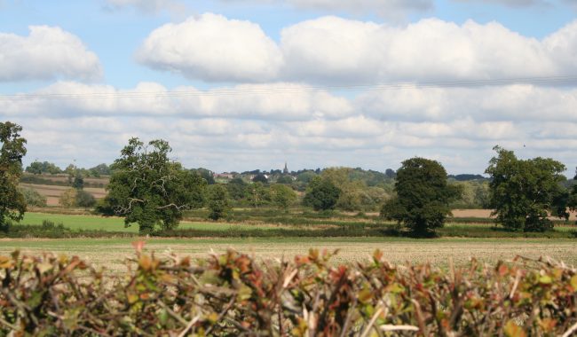View Overlooking Fields With Church Scaled Aspect Ratio 650 380